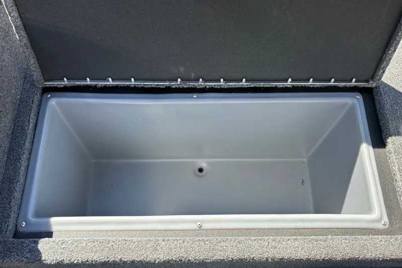 Slide: The Image of Open storage compartment in 2026 Tracker Targa V-18 WT boat. - 29