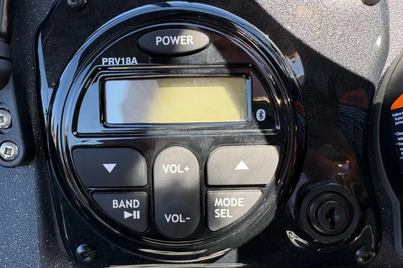 Slide: The Image of Control panel of 2026 Tracker Targa V-18 WT boat with audio system buttons. - 20