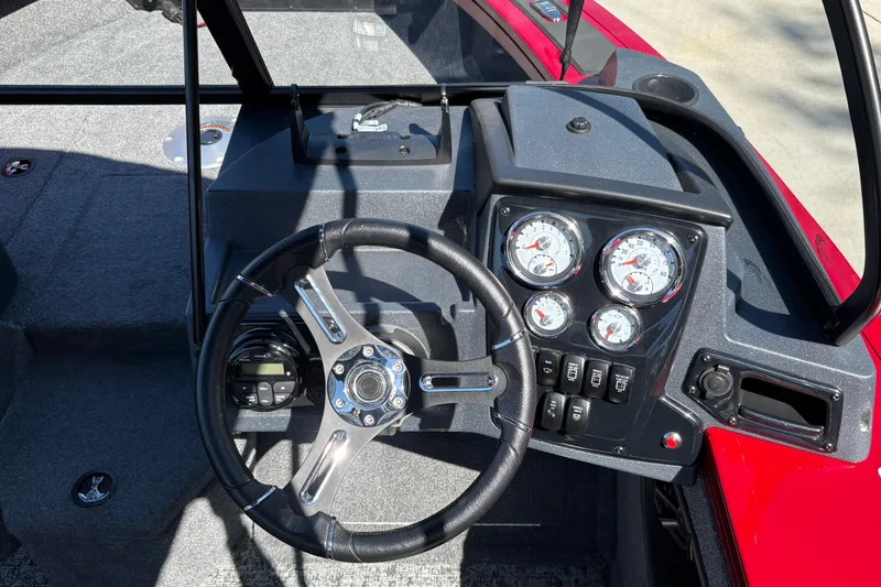 Slide: The Image of Steering console of 2026 Tracker Targa V-18 WT boat with gauges and controls. - 14