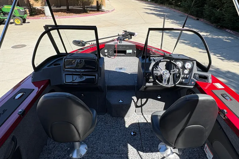 Slide: The Image of Interior view of 2026 Tracker Targa V-18 WT boat with dual seats and steering console. - 19