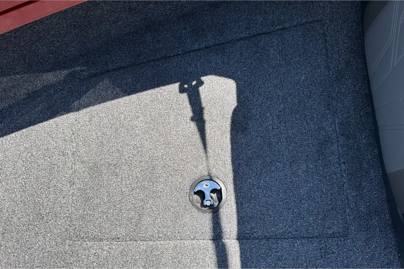Slide: The Image of Carpeted deck of 2026 Tracker Targa V-18 WT boat with a metal latch. - 51