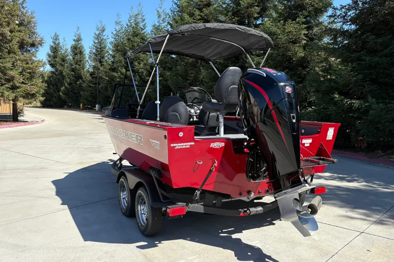 Slide: The Image of 2026 Tracker Targa V-18 WT boat with outboard motor on trailer. - 12