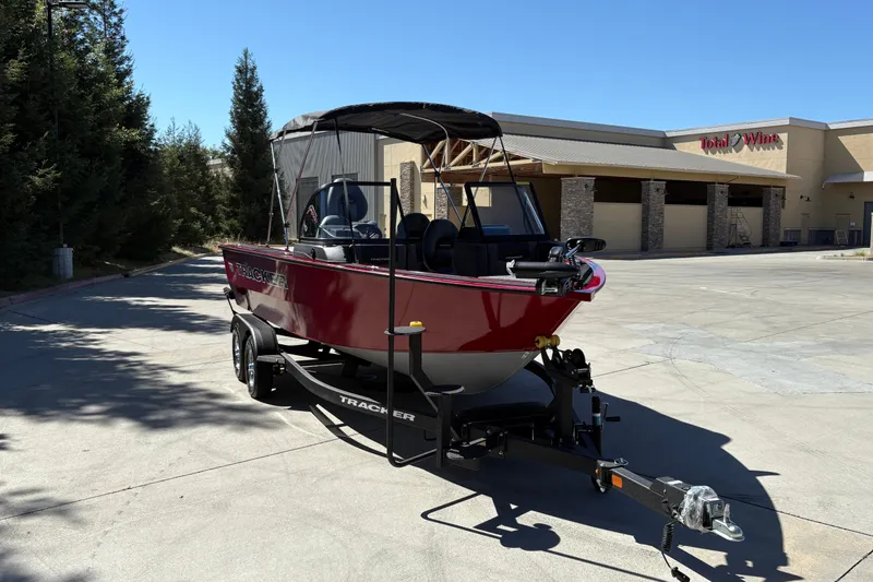 Slide: The Image of 2026 Tracker Targa V-18 WT boat on trailer in parking lot. - 7