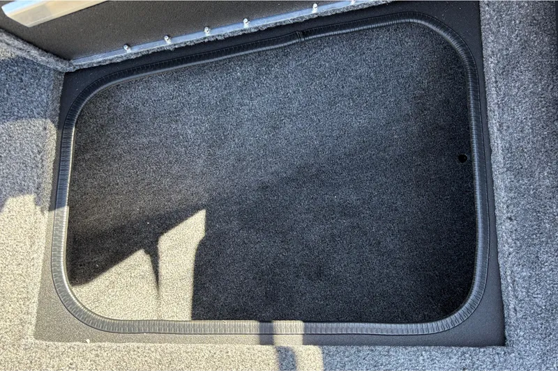 Slide: The Image of Carpeted storage compartment in 2026 Tracker Targa V-18 WT boat interior. - 47
