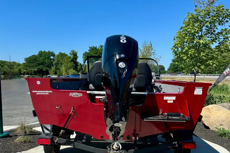 Slide: The Image of 2026 Tracker Targa V-18 WT boat with powerful outboard motor, parked outdoors. - 82