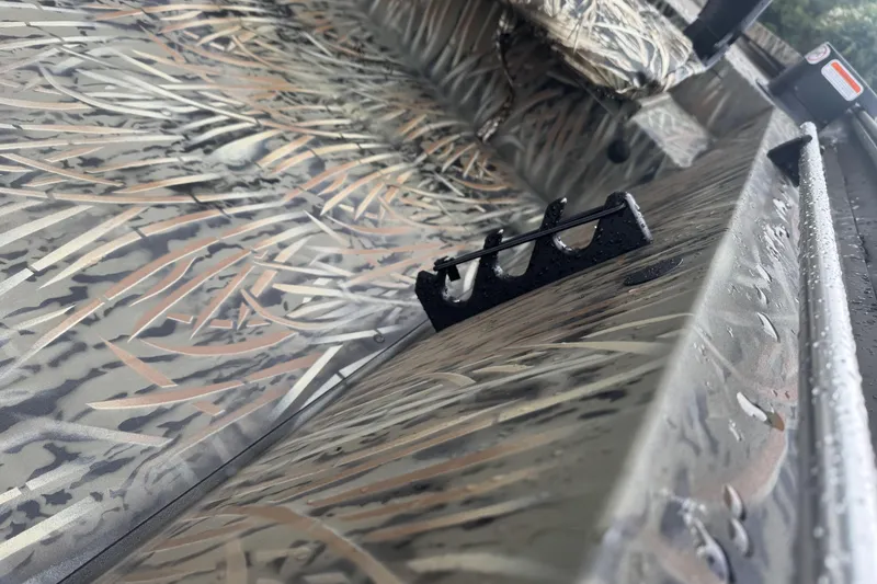 Slide: The Image of 2026 Tracker Grizzly 1754 SC boat with camouflage pattern and rod holder. - 40