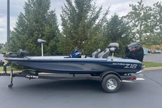 Slide: The Image of 2026 Nitro Z18 Pro boat on trailer, parked outdoors with trees in background. - 1