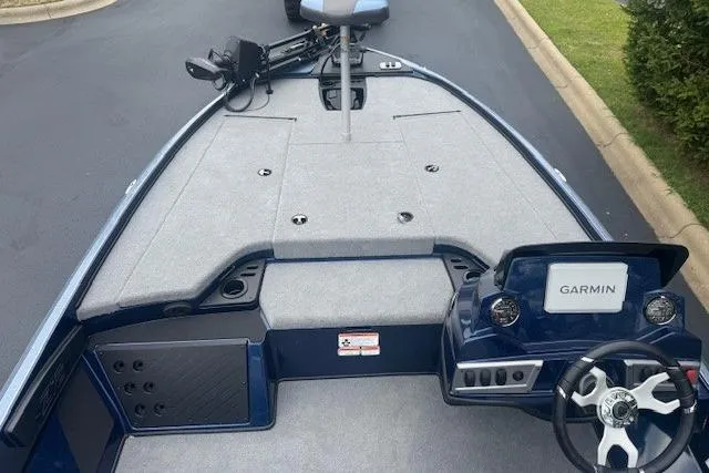 Slide: The Image of 2026 Nitro Z18 Pro boat interior with Garmin navigation system, gray deck, and steering wheel. - 3