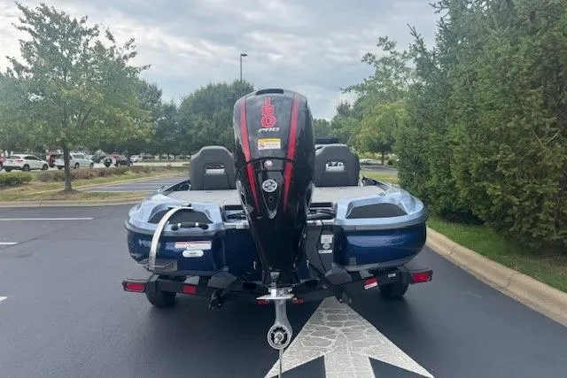 Slide: The Image of 2026 Nitro Z18 Pro boat with powerful outboard motor, parked outdoors. - 5