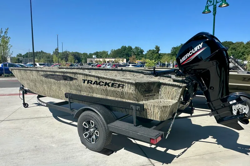 The Image of 2026 Tracker Grizzly 1650 T Prairie Wings Edition boat on trailer, outdoors. - 0