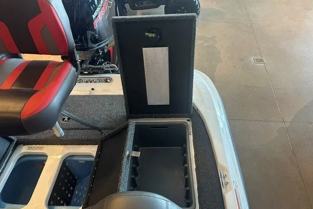 Slide: The Image of 2026 Nitro Z17 boat interior with open storage compartment and red-accented seating. - 22