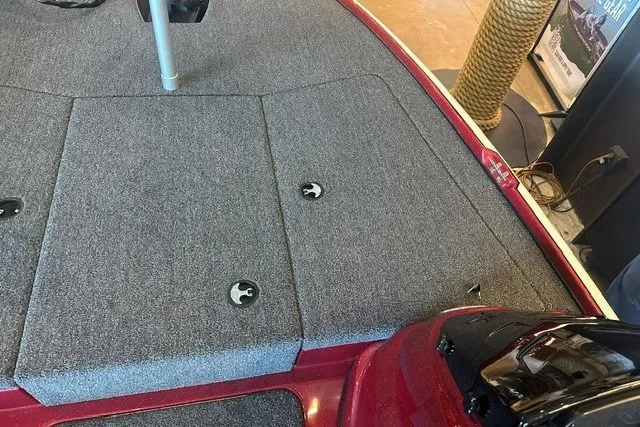 Slide: The Image of 2026 Nitro Z17 boat deck with gray carpet and storage compartments. - 8