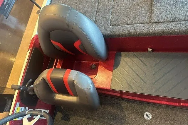 Slide: The Image of 2026 Nitro Z17 boat interior with gray and red seats, textured flooring. - 6