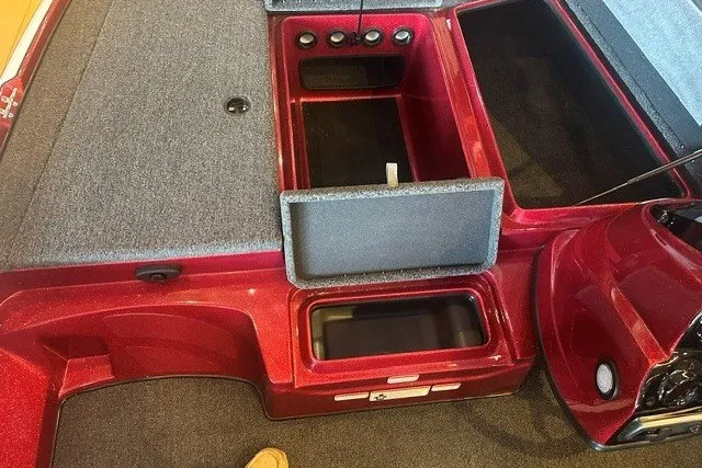 Slide: The Image of 2026 Nitro Z17 boat interior with open storage compartments and red finish. - 10