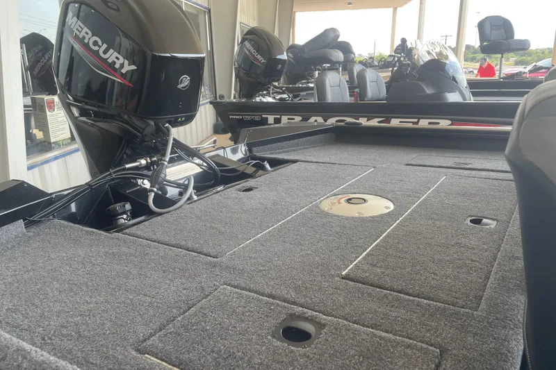 Slide: The Image of 2026 Tracker Pro Team 175 Crappie Edition boat with Mercury engine, spacious deck view. - 5