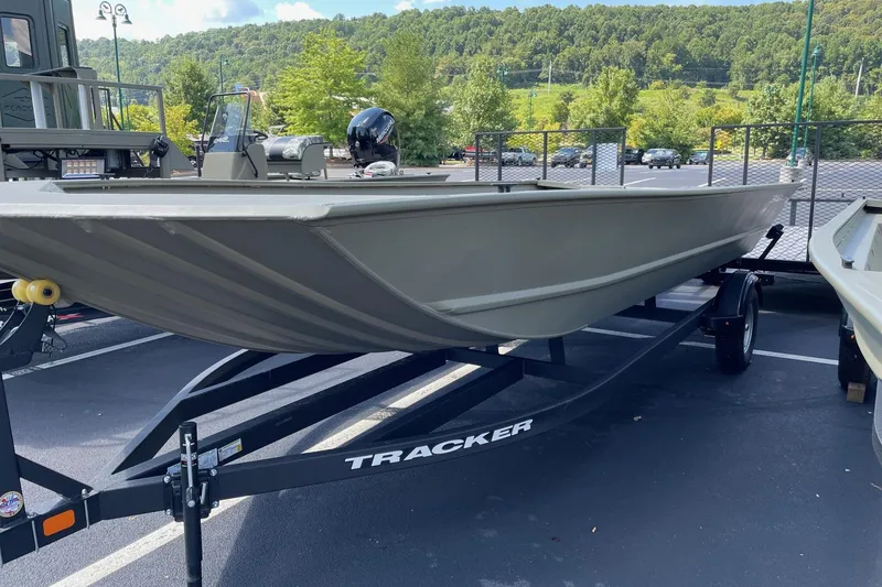 The Image of 2026 Tracker GRIZZLY 2072 Utility boat on trailer, parked outdoors. - 0