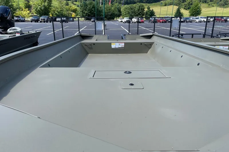 Slide: The Image of 2026 Tracker GRIZZLY 2072 Utility boat, spacious interior, parked outdoors. - 2