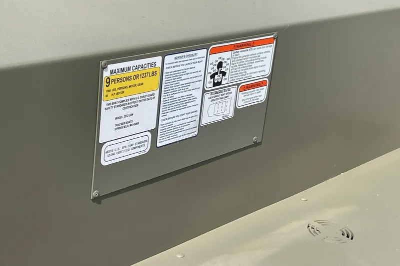 Slide: The Image of Capacity and safety labels on 2026 Tracker GRIZZLY 2072 Utility boat. - 3