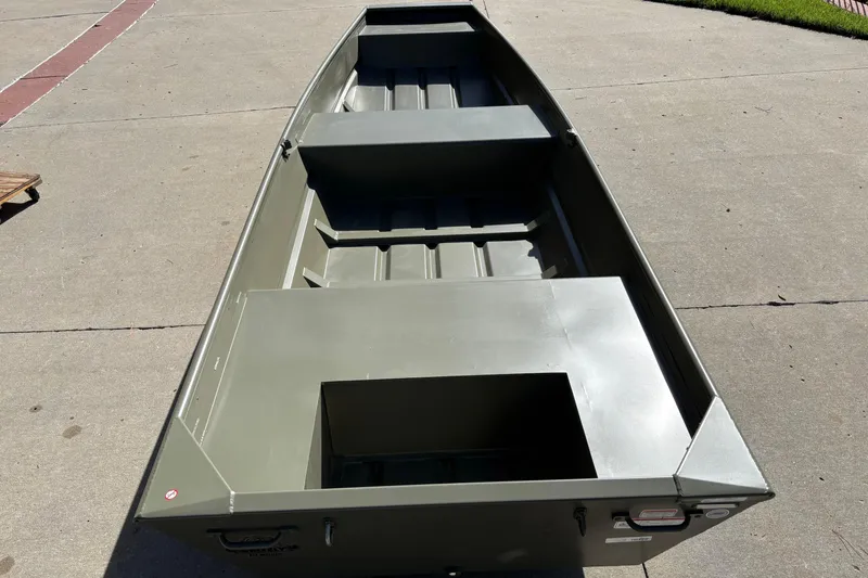 Slide: The Image of 2026 Tracker Grizzly 14 Jon boat on concrete surface, showcasing interior layout and design. - 2
