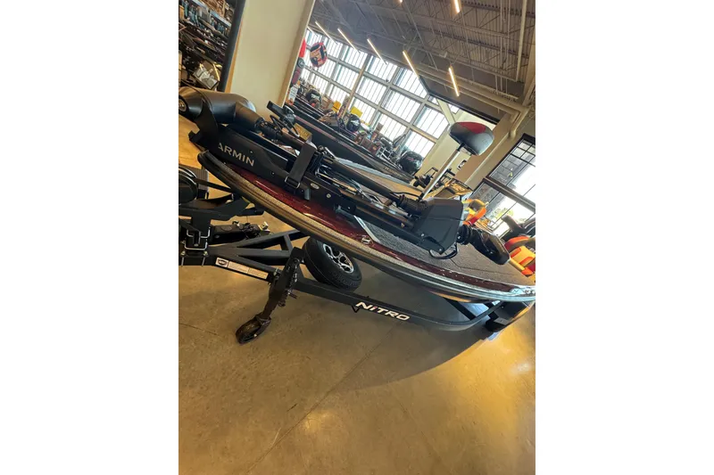 The Image of 2026 Nitro Z20 XL Pro fishing boat displayed indoors with Garmin equipment. - 0