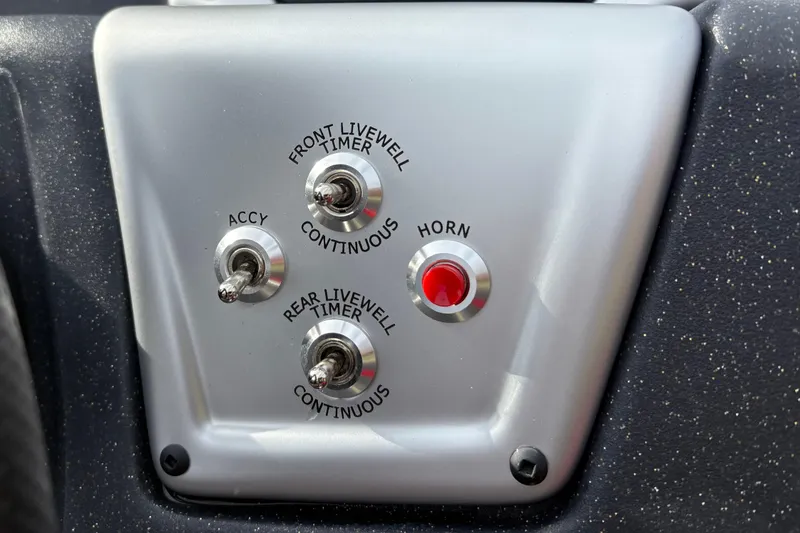 Slide: The Image of Control panel of 2026 Tracker Pro Team 175 Crappie Edition boat with switches and horn button. - 18