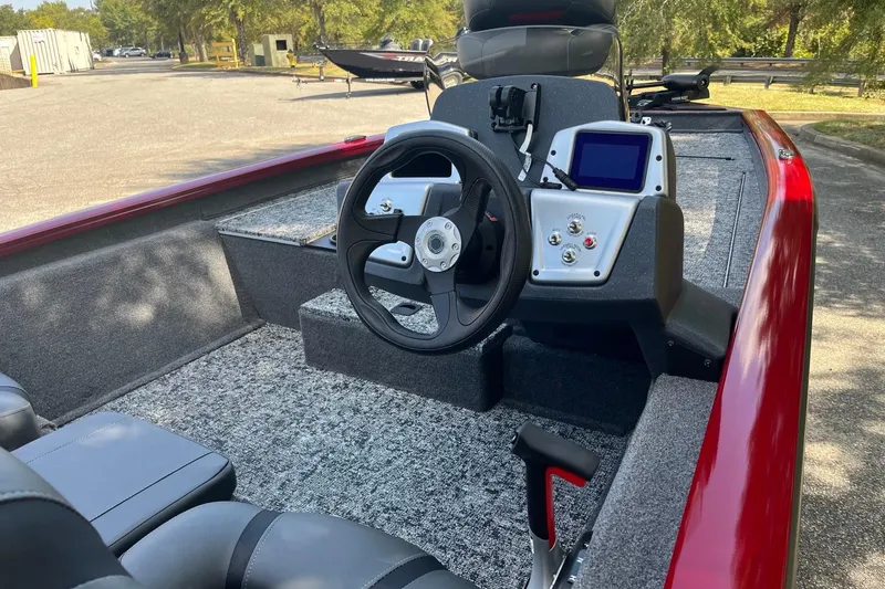Slide: The Image of 2026 Tracker Pro Team 175 boat interior with steering wheel and control panel. - 6