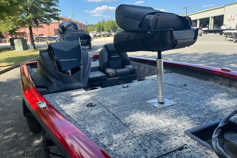Slide: The Image of 2026 Tracker Pro Team 175 boat with elevated seating and spacious deck in a sunny outdoor setting. - 7
