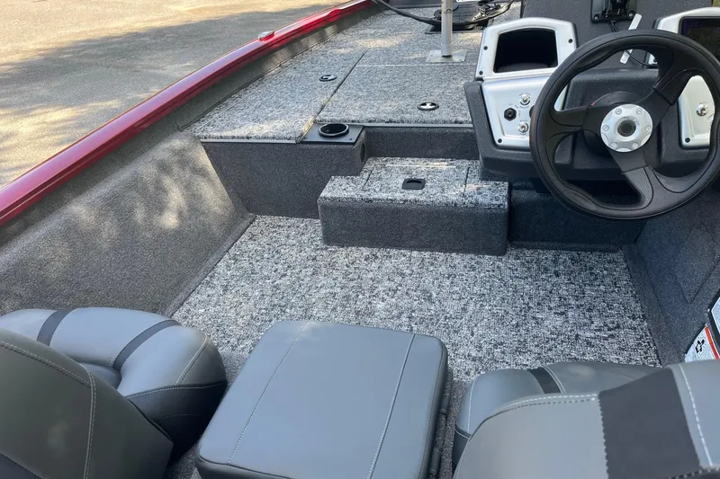 Slide: The Image of 2026 Tracker Pro Team 175 boat interior with steering wheel and seating. - 8