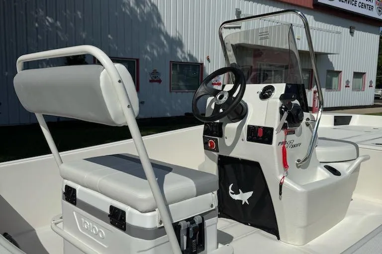 Slide: The Image of 2026 Mako Pro Skiff 17 CC boat interior with steering console and seating. - 6