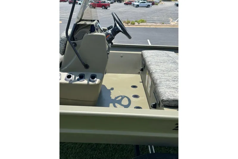 Slide: The Image of Interior view of 2026 Tracker Grizzly 1860 Utility boat with steering console and seating. - 15