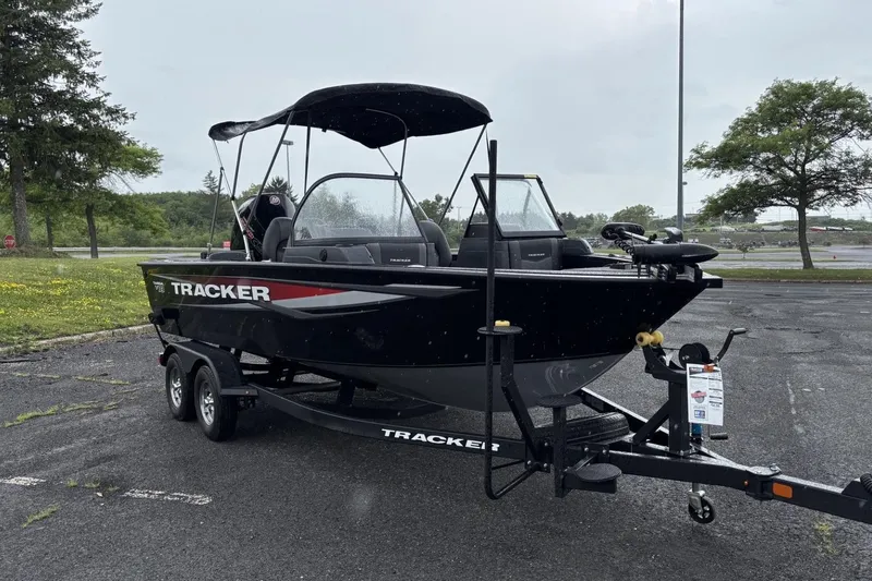 Slide: The Image of 2026 Tracker Targa V-18 Combo boat on trailer in parking lot. - 4