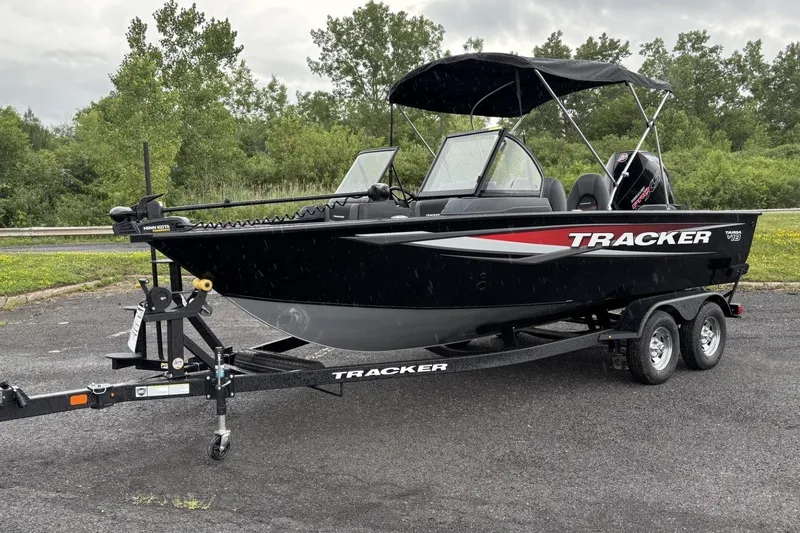 The Image of 2026 Tracker Targa V-18 Combo boat on trailer, parked outdoors. - 0