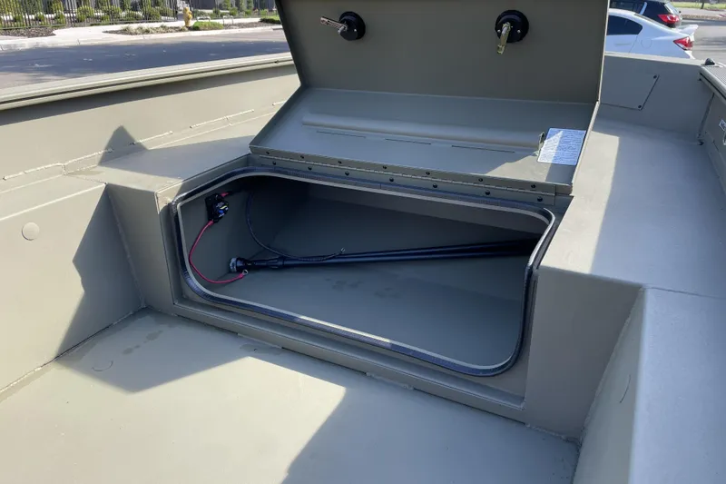 Slide: The Image of Open storage compartment in 2026 Tracker Grizzly 1650 T Prairie Wings Edition boat. - 10