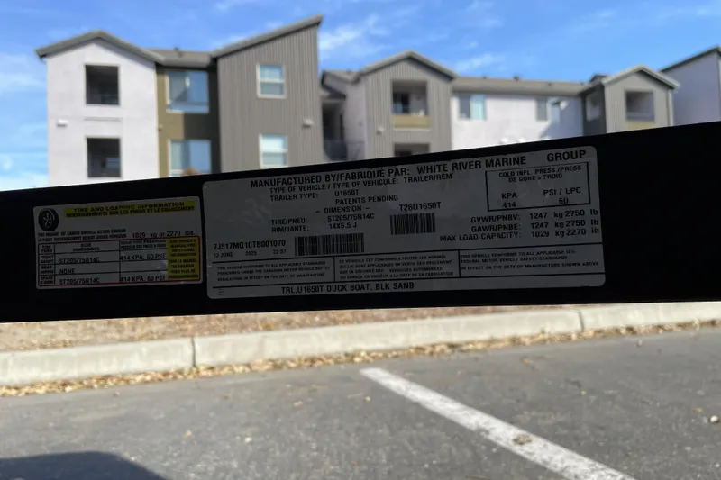 Slide: The Image of Sticker on 2026 Tracker Grizzly 1650 T Prairie Wings Edition trailer, showing specifications and load capacity. - 43