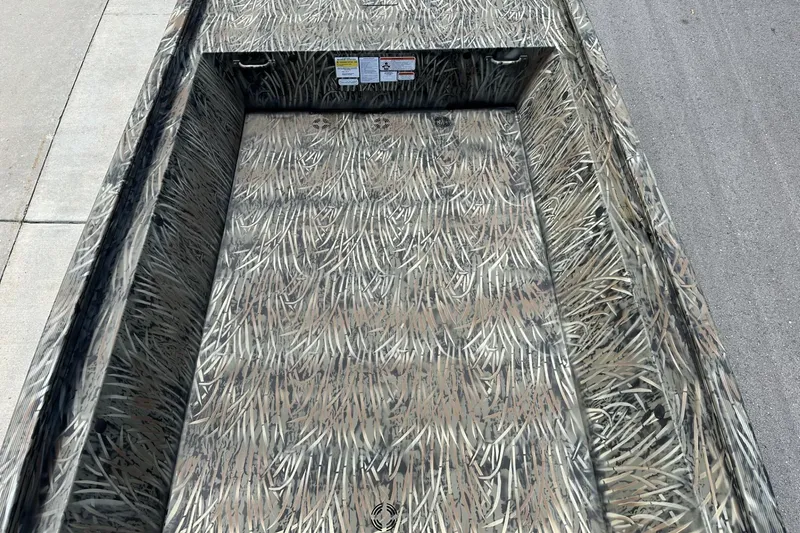 Slide: The Image of 2026 Tracker Grizzly 1648 Utility boat with camouflage interior design. - 8