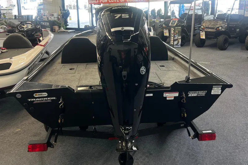 Slide: The Image of 2026 Tracker Pro Team 175 boat with Mercury engine displayed indoors. - 7