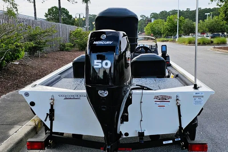 Slide: The Image of 2026 Tracker Pro 170 boat with Mercury 50 engine, parked outdoors. - 3