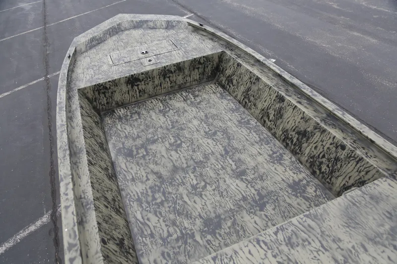 Slide: The Image of 2026 Tracker Grizzly 1648 Utility boat with camouflage interior design. - 4