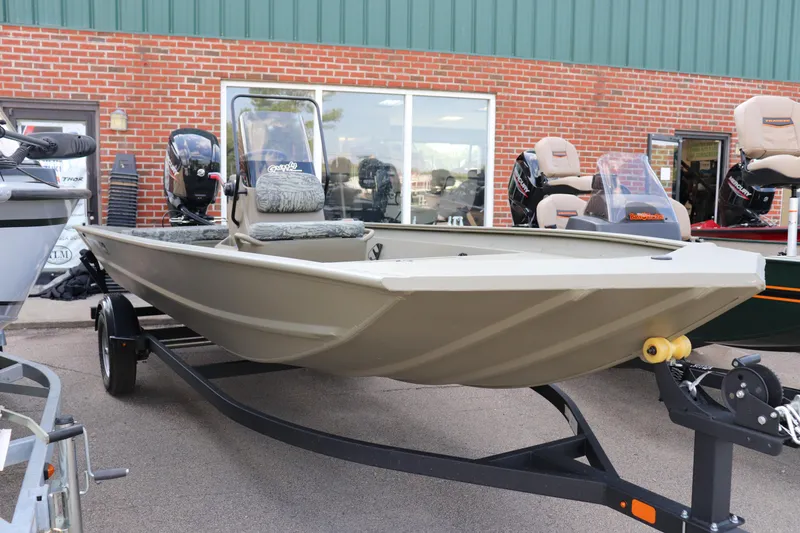 The Image of 2026 Tracker Grizzly 1860 CC boat on trailer, displayed outdoors. - 0