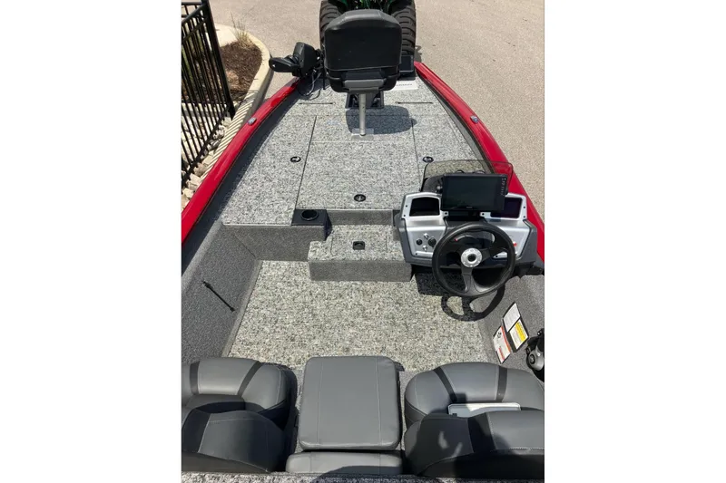 Slide: The Image of 2026 Tracker Pro Team 190 boat interior with steering console and seating. - 7