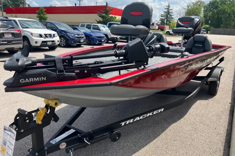 Slide: The Image of 2026 Tracker Pro Team 190 boat with Garmin equipment on a trailer in a parking lot. - 4
