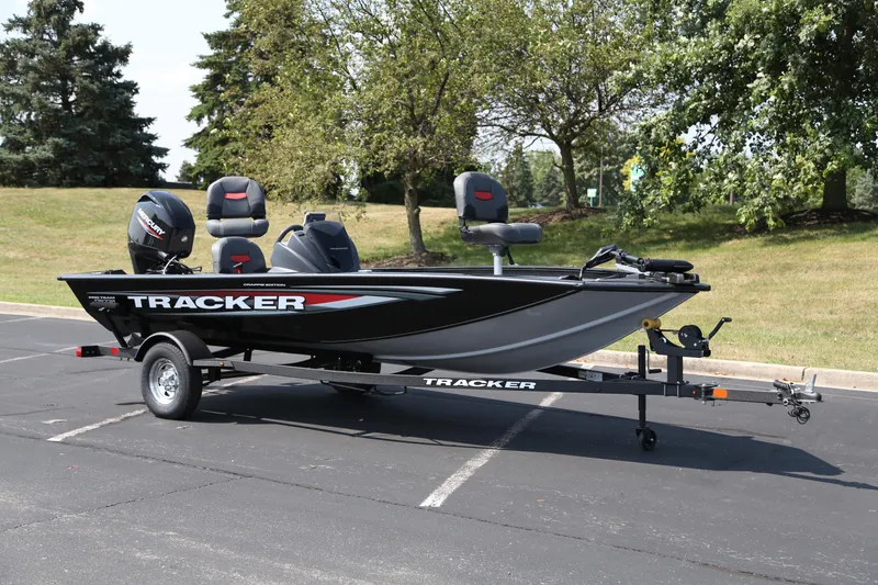 The Image of 2026 Tracker Pro Team 175 Crappie Edition boat on trailer, parked outdoors. - 0