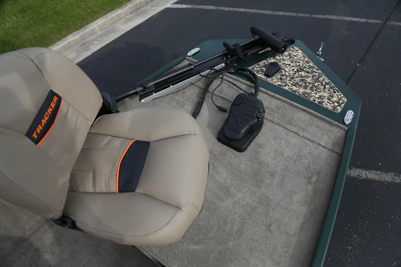 Slide: The Image of 2026 Tracker Bass Tracker Classic Limited boat interior with seat and trolling motor. - 2
