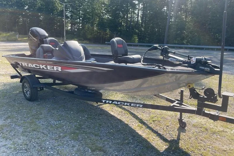 Slide: The Image of 2026 Tracker Pro Team 175 boat on trailer, parked outdoors in sunlight. - 3