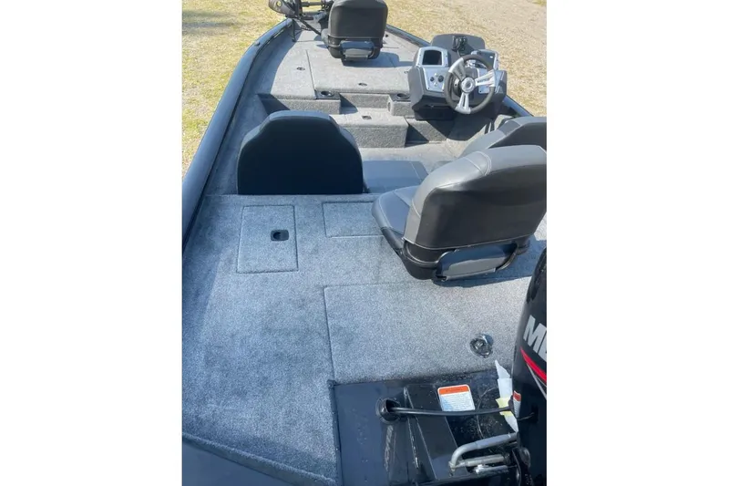 Slide: The Image of 2026 Tracker Pro Team 175 boat interior with seating and steering console. - 6