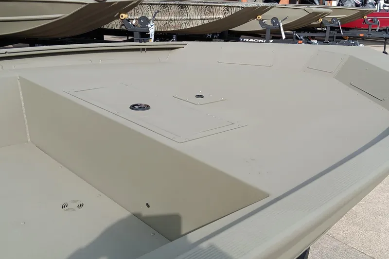 Slide: The Image of 2026 Tracker Grizzly 1754 Utility boat deck, showcasing storage compartments and durable design. - 3