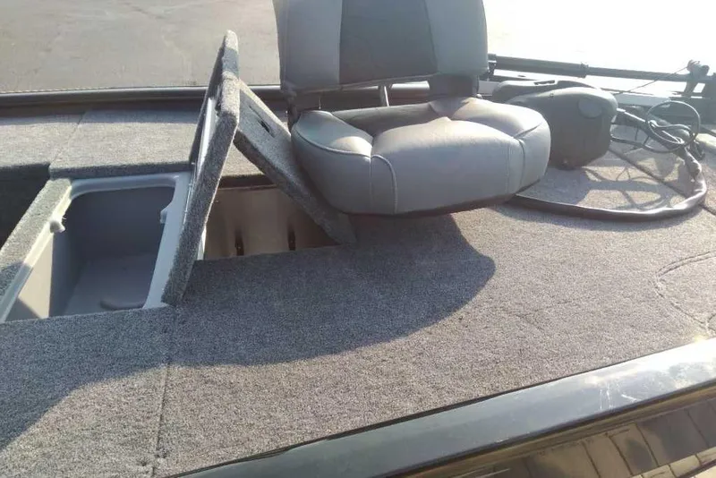 Slide: The Image of 2026 Tracker Pro 170 boat interior with seating and storage compartments. - 2