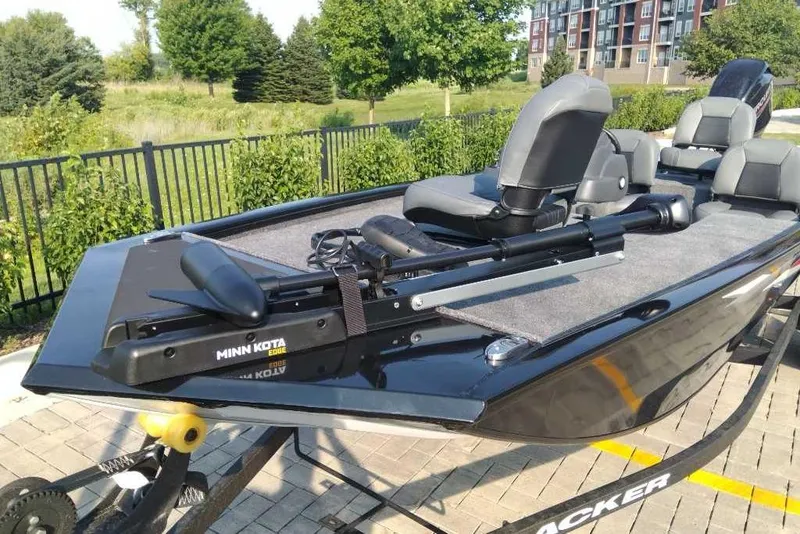Slide: The Image of 2026 Tracker Pro 170 boat with Minn Kota Edge trolling motor, parked outdoors. - 4
