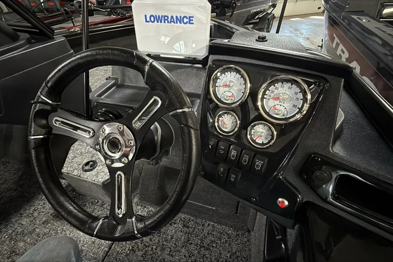 Slide: The Image of 2026 Tracker Targa V-18 WT dashboard with steering wheel and gauges. - 3