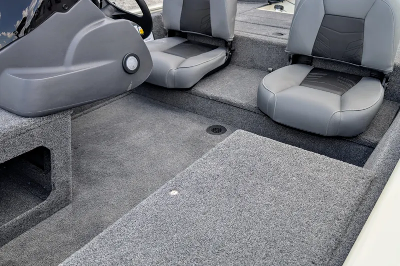 Slide: The Image of 2026 Tracker Pro 170 boat interior with gray seating and carpeted flooring. - 6